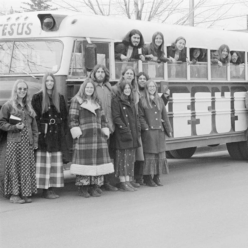 People standing in front of the Jesus bus in the early 70s